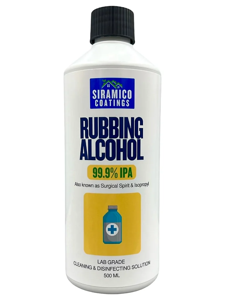 Rubbing alcohol bottle with a cotton pad on a clean surface